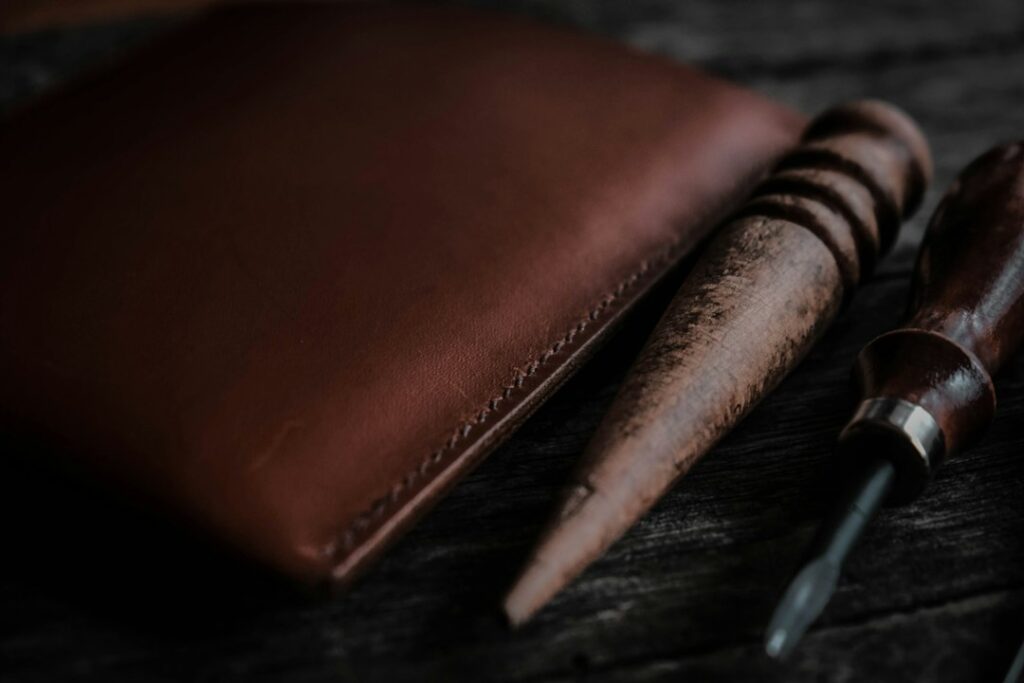 Leather craft and care tools used to keep a leather wallet in good shape